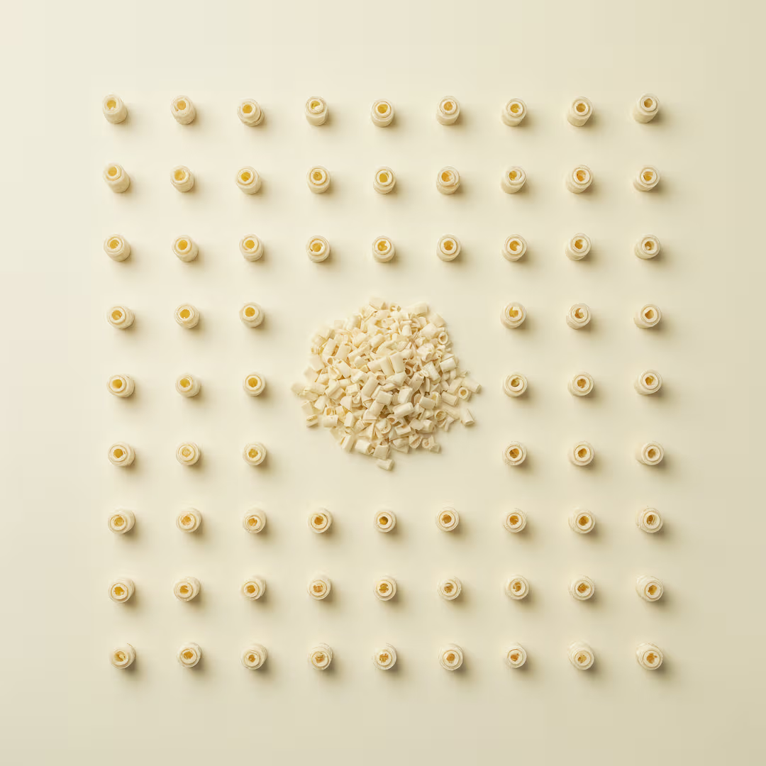 White blossom curls snack from Barlo by Papagino Foods Inc., 1 kg bag featuring crispy, flower-shaped white snack curls.