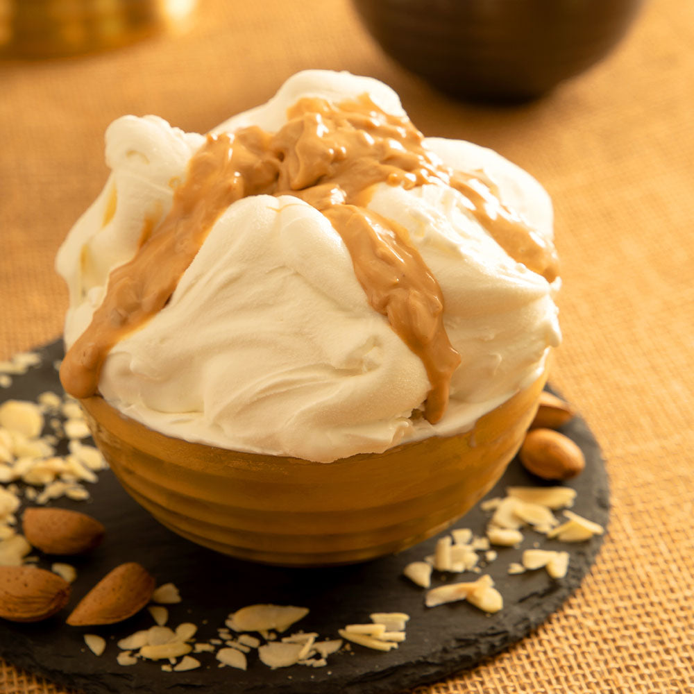 PreGel Almond Crystal Arabeschi by Papagino Foods Inc. in a 3 kg package, featuring a clear almond-flavored crystal topping or confection.