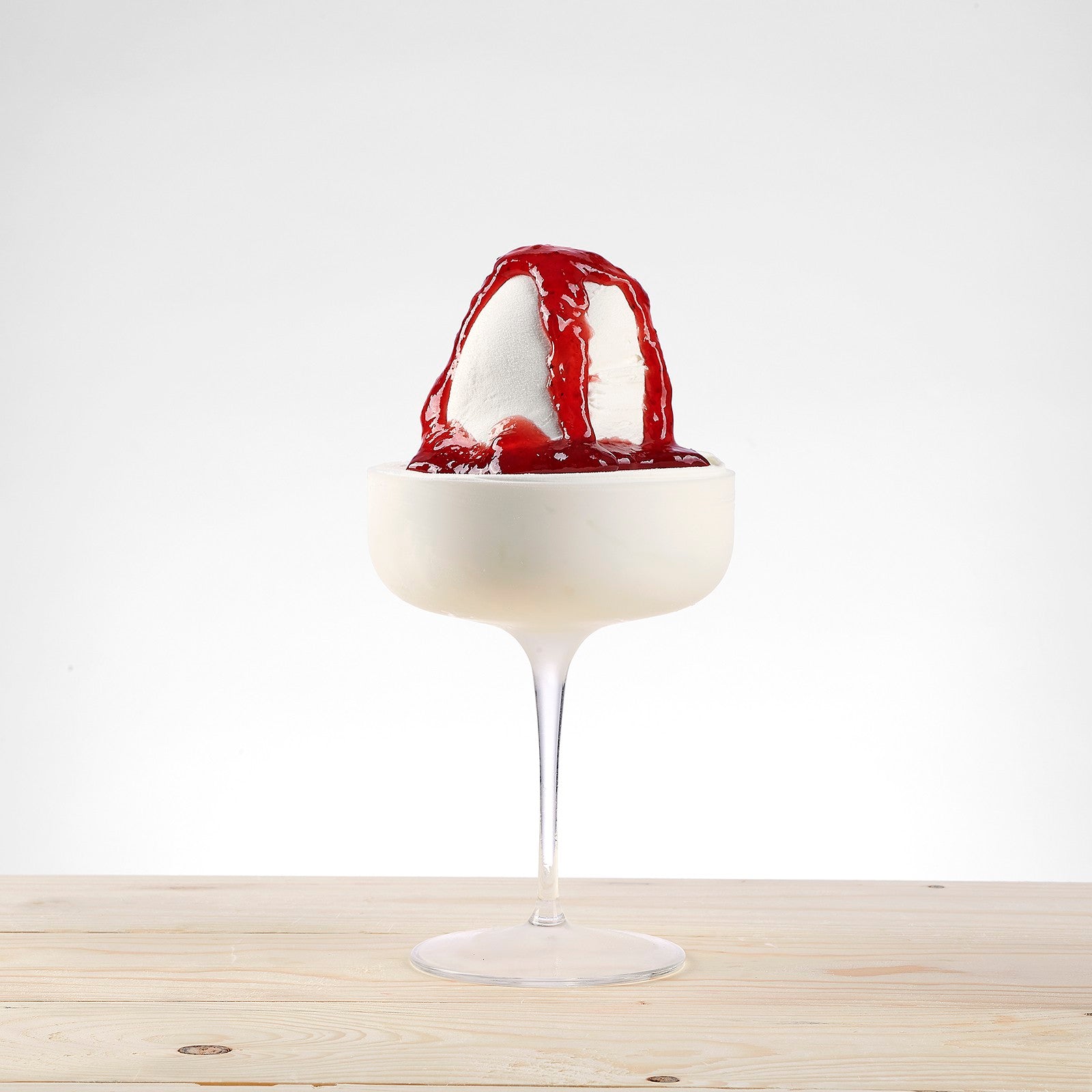 PreGel Strawberry Extra frozen dessert in a clear container, showcasing vibrant pink strawberry flavor and creamy texture.