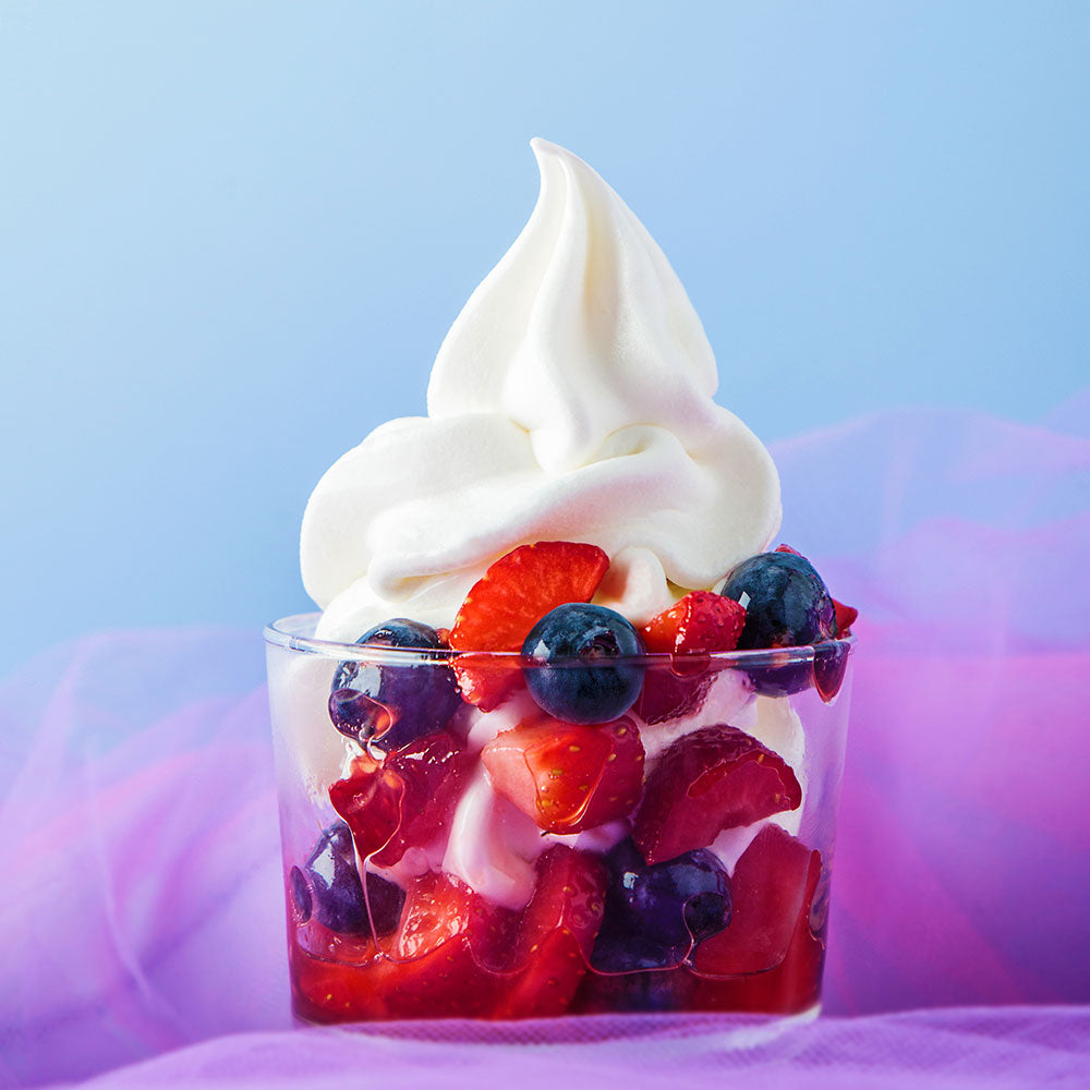 Soft serve yogurt cone featuring PreGel Angel's Yogurt, a creamy vanilla-flavored frozen dessert by Papagino Foods Inc.