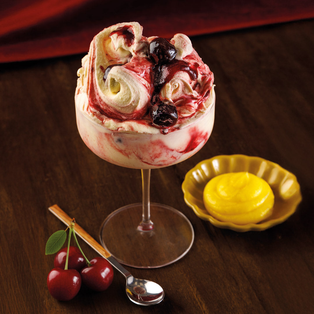 PreGel Base Completa Vegan from Papagino Foods Inc., creamy plant-based mixture in a bowl, ready for dessert preparation.