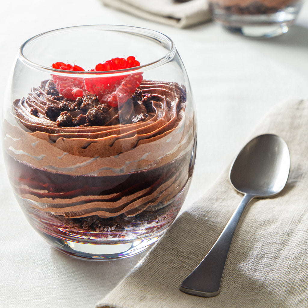 Creamy chocolate mousse in a bowl, topped with whipped cream and chocolate shavings, from PreGel Pronto by Papagino Foods Inc.