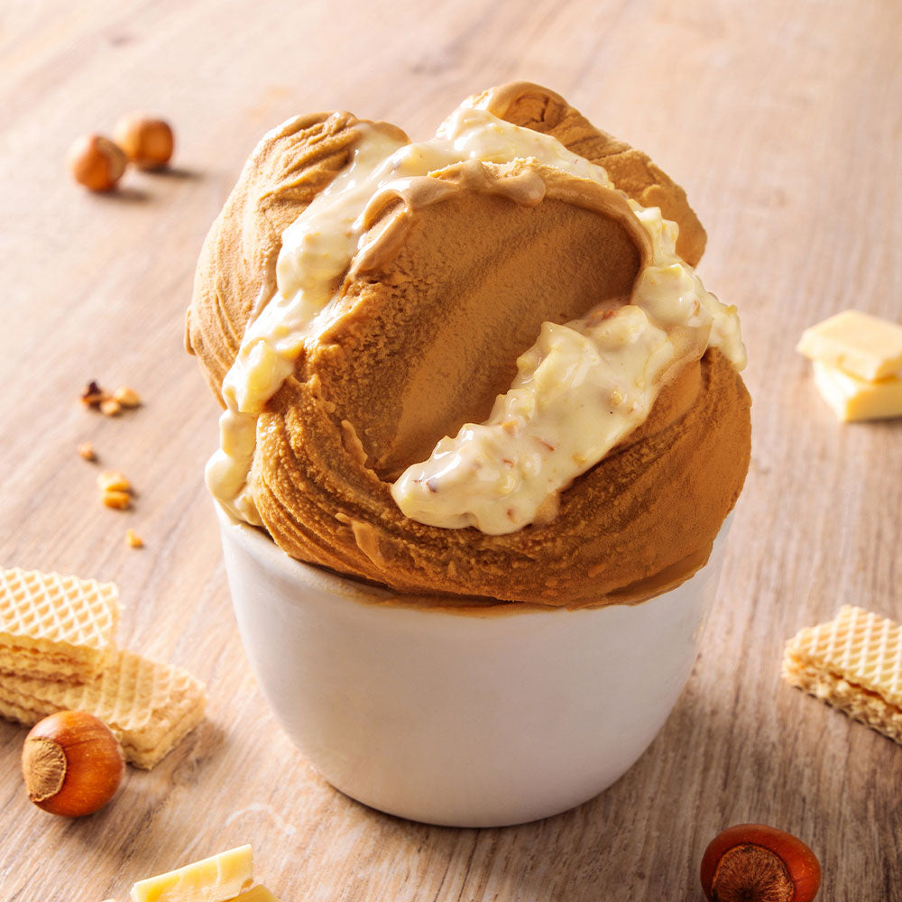 PreGel Cioccobianco Hazelnut Rock by Papagino Foods Inc., a chocolate and hazelnut confection with textured surface.