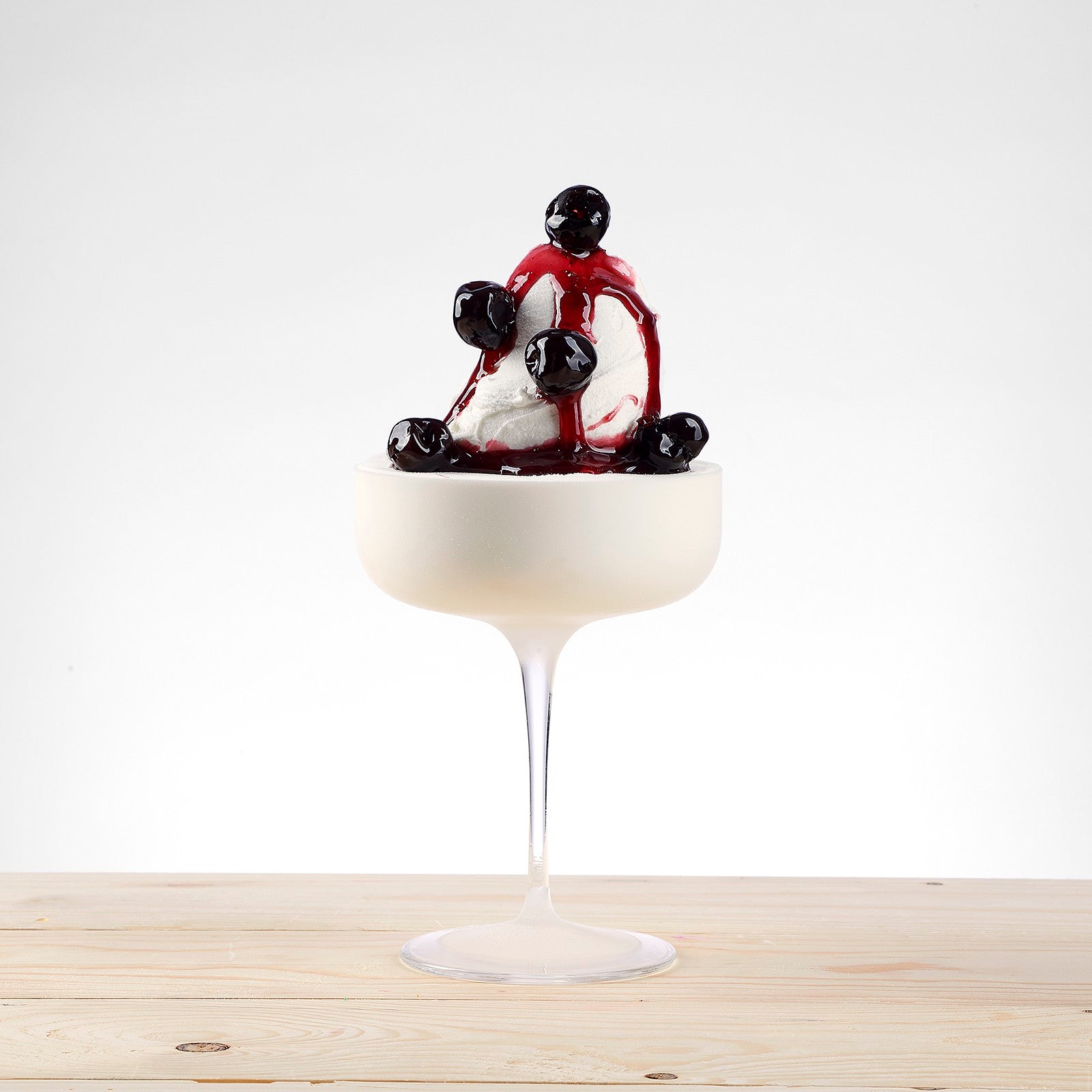 PreGel Amarena Frutto Arabeschi cherry topping jar from Papagino Foods Inc. with dark cherry fruit and syrup inside.